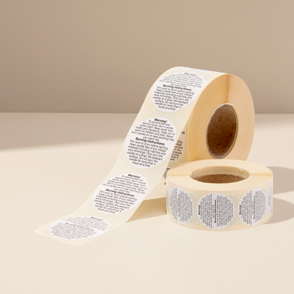 Roll of 1000 round 50mm candle safety stickers with warning and burning instructions printed in black text.